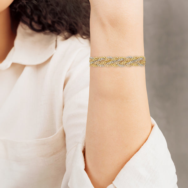 Pulsera eslabón trenzado en oro tres tonos 14 kilates.