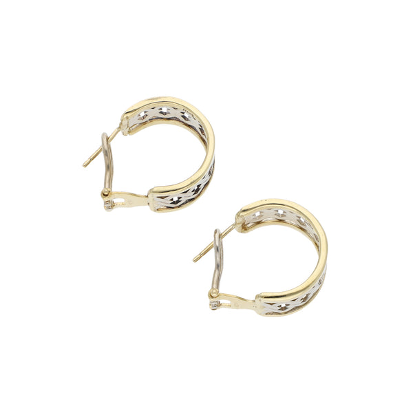 Aretes calados en oro dos tonos 14 kilates.
