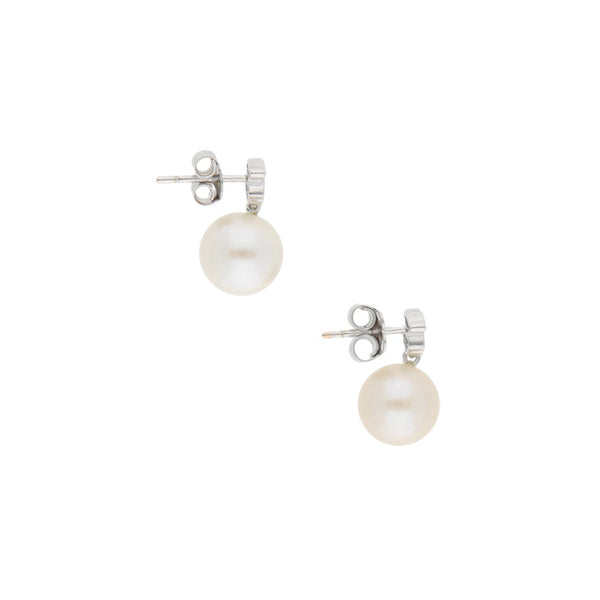 Broqueles diseño especial con diamantes y perlas firma Tous en oro blanco 18 kilates.