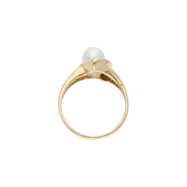 Anillo diseño especial con diamantes y perla en oro amarillo 14 kilates.