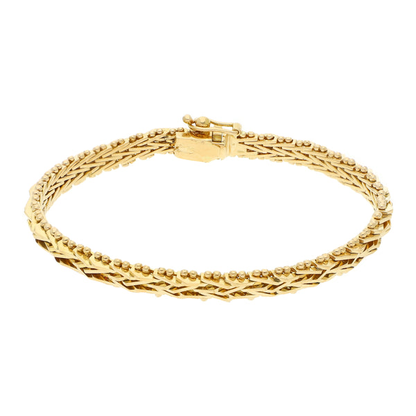 Pulsera eslabón boleado en oro amarillo 18 kilates.