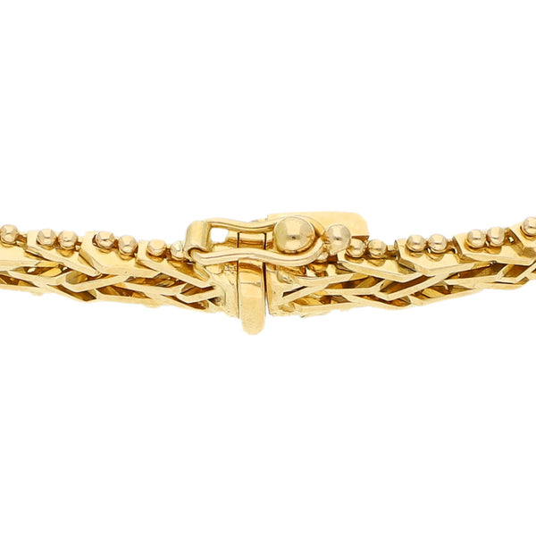 Pulsera eslabón boleado en oro amarillo 18 kilates.