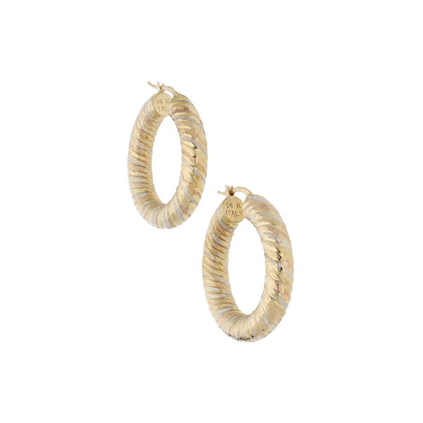 Arracadas trenzadas en oro amarillo 14 kilates.