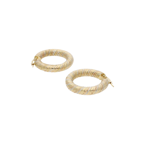 Arracadas trenzadas en oro amarillo 14 kilates.