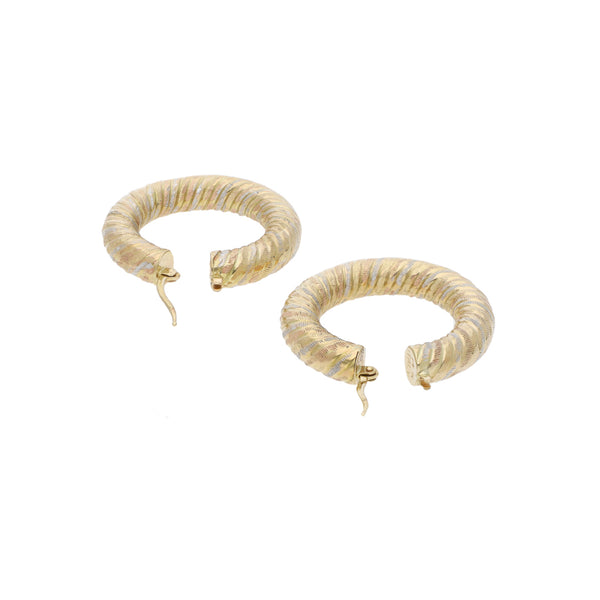 Arracadas trenzadas en oro amarillo 14 kilates.