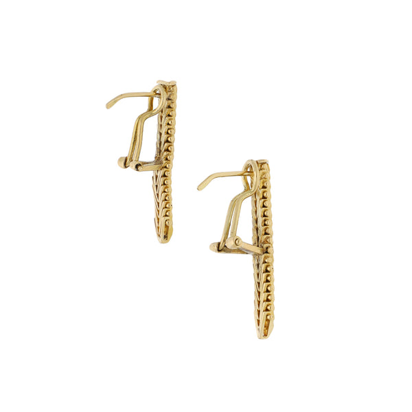 Aretes boleados en oro amarillo 18 kilates.