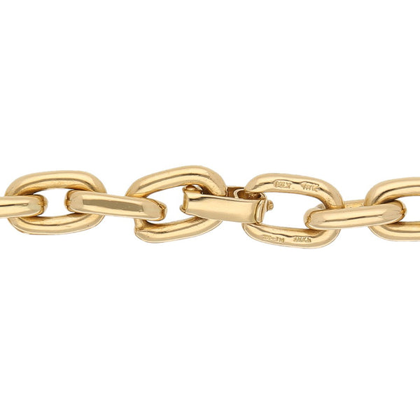 Pulsera eslabón cruzado firma Tane en oro amarillo 18 kilates.