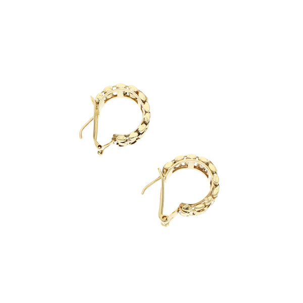 Aretes diseño especial en oro amarillo 14 kilates.