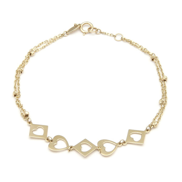 Pulsera dos hilos eslabón cruzado con aplicaciones motivo rombo y corazón en oro amarillo 14 kilates.