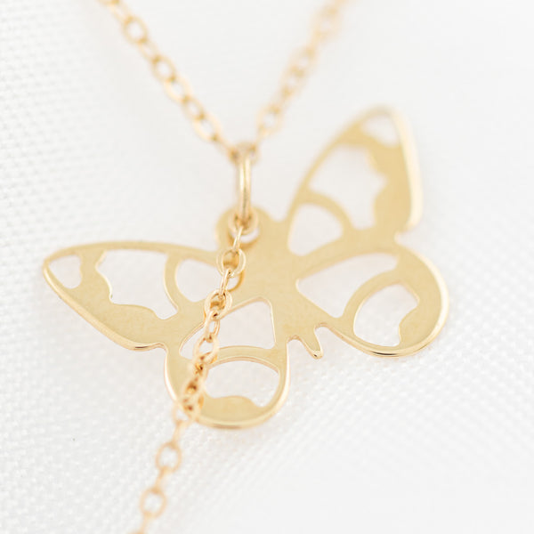 Juego de gargantilla eslabón cruzado aretes con colgantes motivo mariposa en oro amarillo 14 kilates