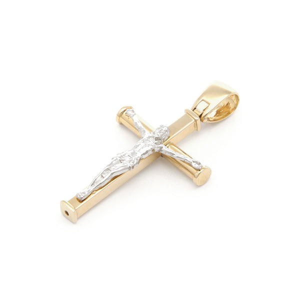 Crucifijo liso en oro dos tonos 14 kilates.