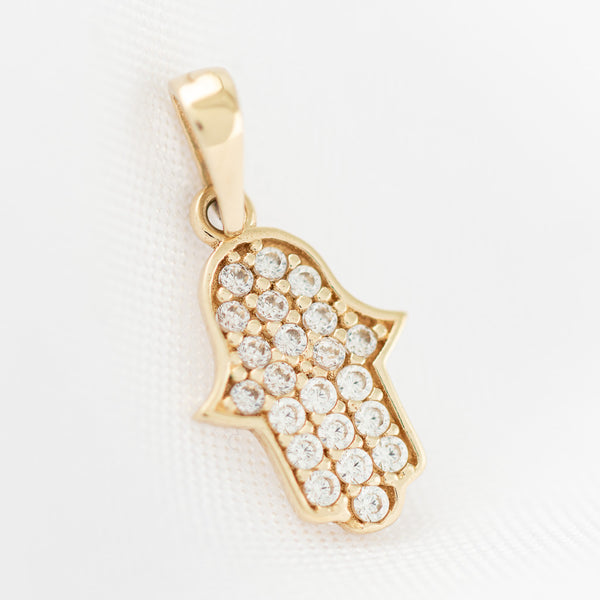 Dije diseño especial motivo mano de Fátima con circonias en oro amarillo 14 kilates.