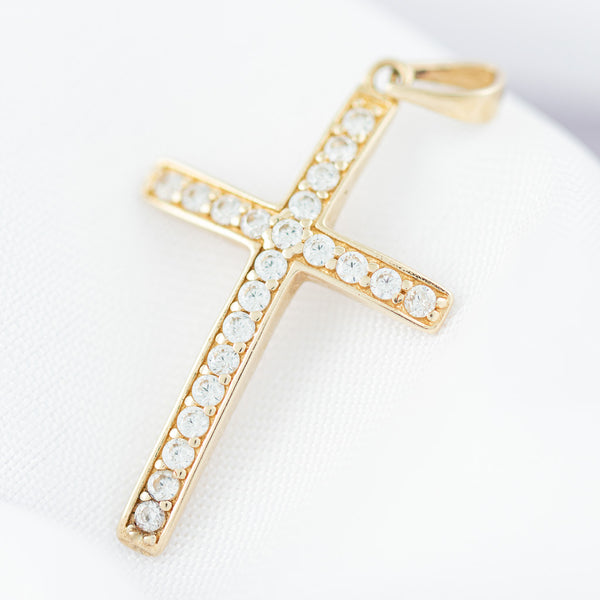 Cruz diseño especial con circonia en oro amarillo 14 kilates.