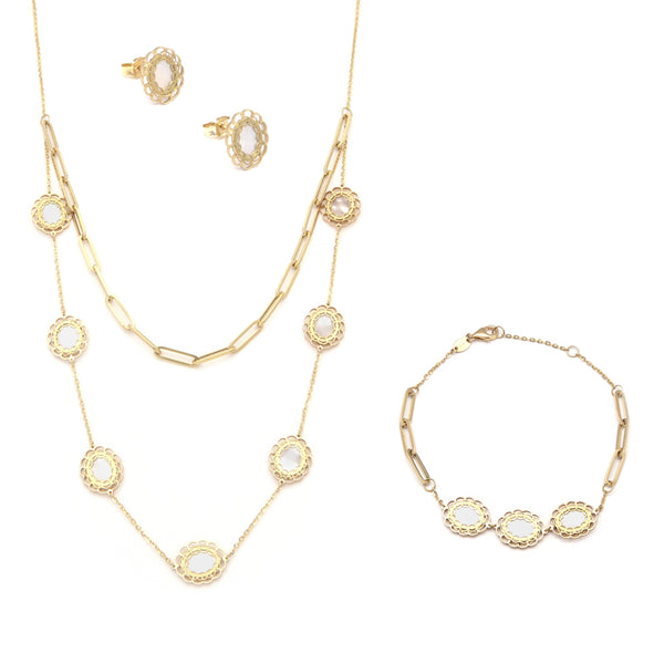 Juego de gargantilla y pulsera eslabón combinado con aplicaciones y aretes con madreperla en oro amarillo 14 kilates.