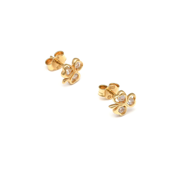 Aretes calados motivo trébol con circonias en oro amarillo 14 kilates.