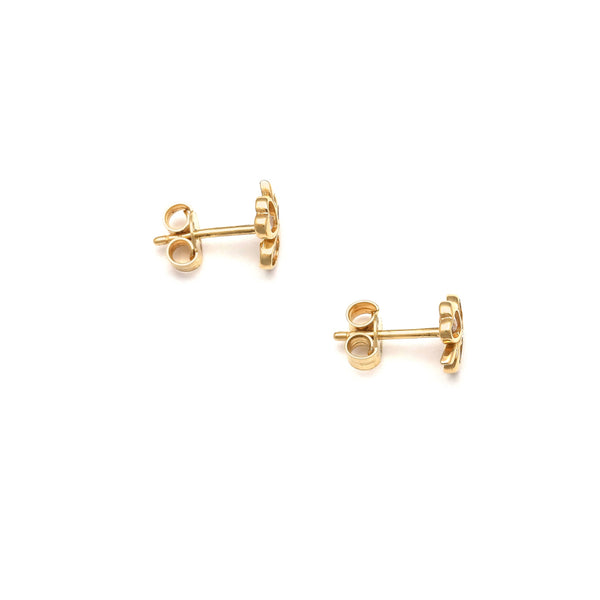Aretes calados motivo trébol con circonias en oro amarillo 14 kilates.