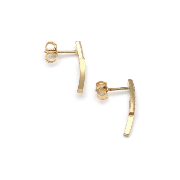 Aretes estilizados con circonias en oro amarillo 14 kilates.