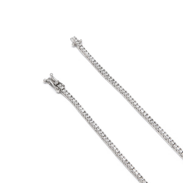 Pulsera eslabón articulado con circonias en oro blanco 14 kilates.