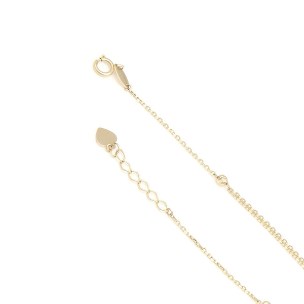 Pulsera eslabón cruzado con aplicaciones motivo corazón y candado de corazón en oro amarillo 14 kilates.