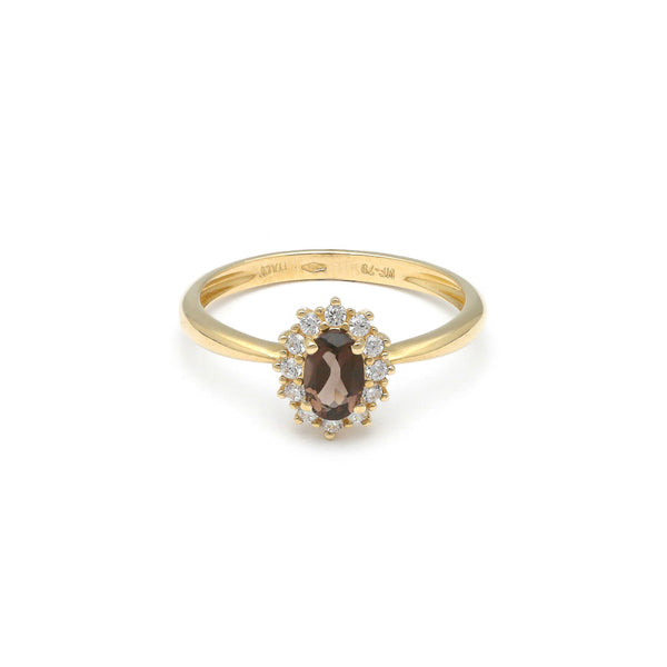 Anillo diseño especial con sintéticos en oro amarillo 14 kilates.