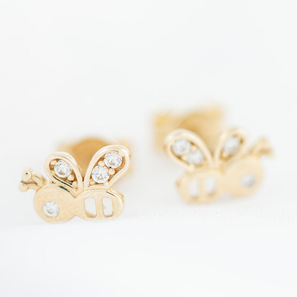 Aretes diseño especial motivo abeja con circonias en oro amarillo 14 kilates.