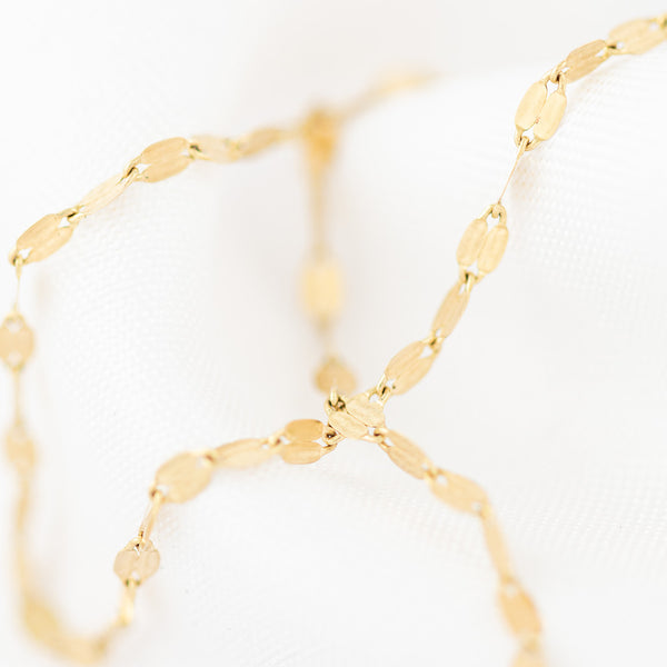 Collar eslabón cruzado en oro amarillo 14 kilates.
