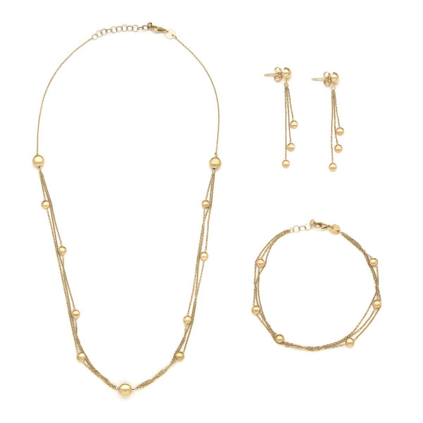 Juego de gargantilla, pulsera eslabón cruzado y aretes con colgantes y cuentas en oro amarillo 14 kilates.