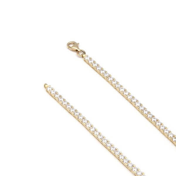 Pulsera eslabón articulado con circonias en oro amarillo 14 kilates.