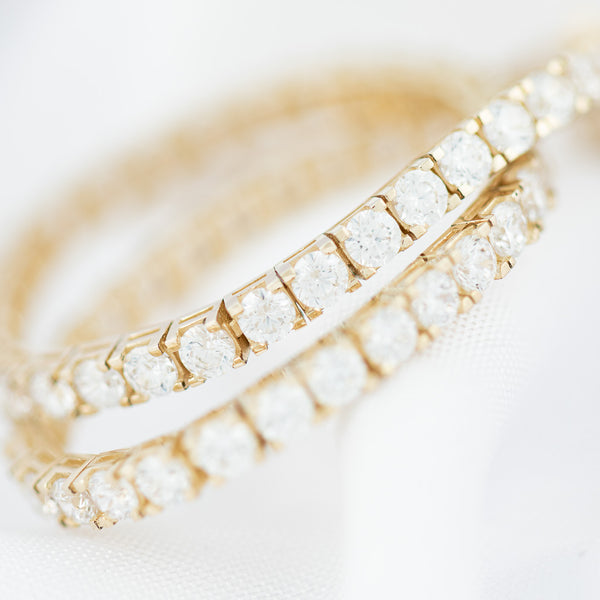 Pulsera eslabón articulado con circonias en oro amarillo 14 kilates.