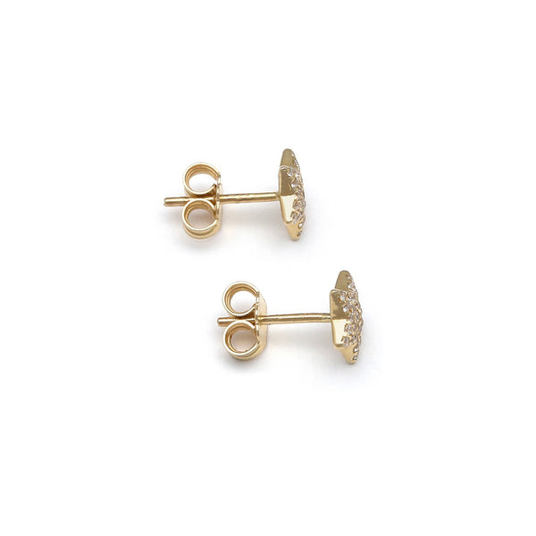 Aretes diseño especial motivo estrella con circonias en oro amarillo 14 kilates.