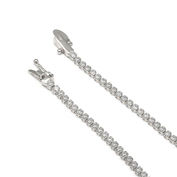 Pulsera eslabón articulado con circonias en oro blanco 14 kilates.