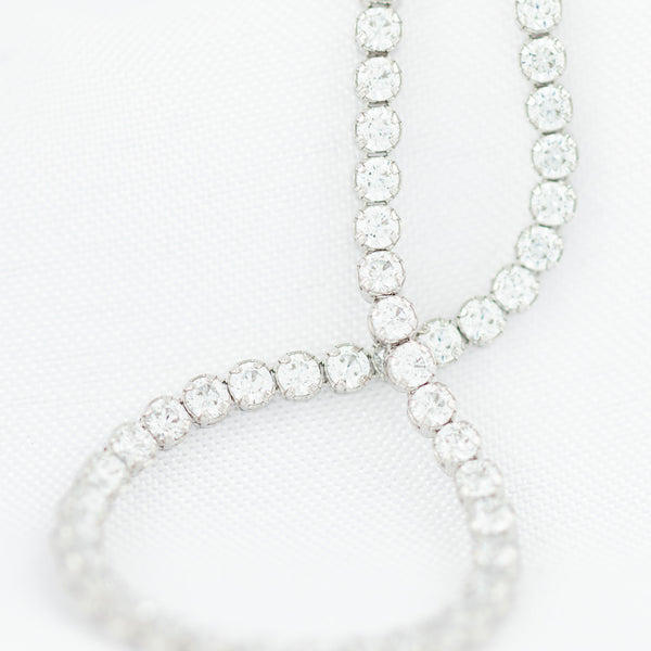 Pulsera eslabón articulado con circonias en oro blanco 14 kilates.