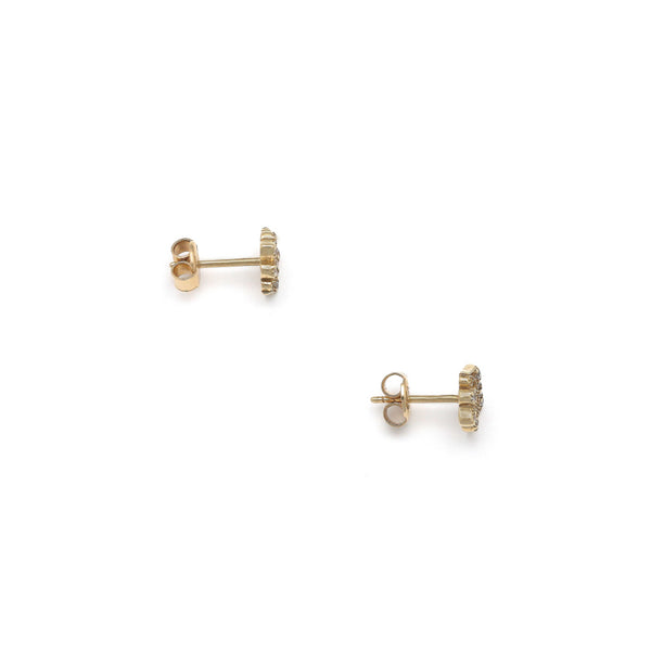 Aretes calados motivo corona con circonias en oro amarillo 14 kilates.