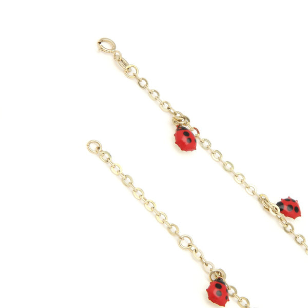 Pulsera eslabón cruzado con colgantes motivo catarinas con esmalte en oro amarillo 14 kilates.
