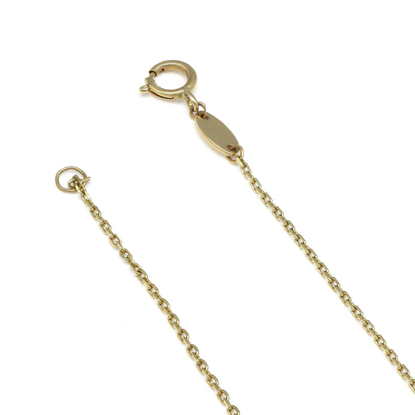 Pulsera eslabón cruzado con aplicación motivo cruz y circonias en oro amarillo 14 kilates.