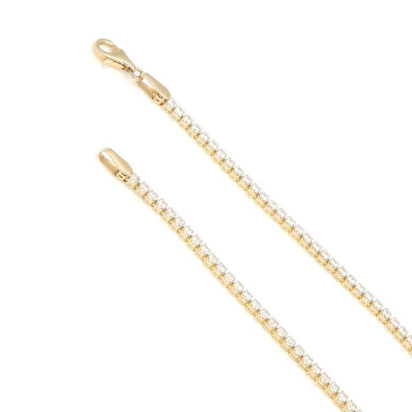 Pulsera eslabón articulado con circonias en oro amarillo 14 kilates.