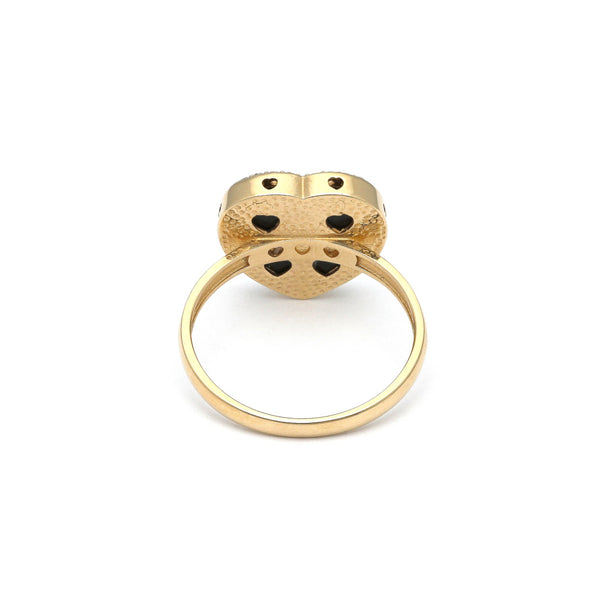Anillo diseño especial motivo corazón con sintéticos en oro amarillo 14 kilates.