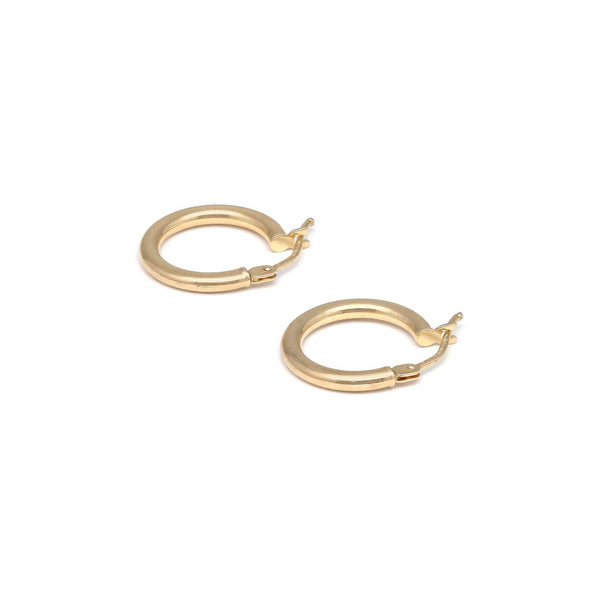 Arracadas tubulares huecas en oro amarillo 14 kilates.