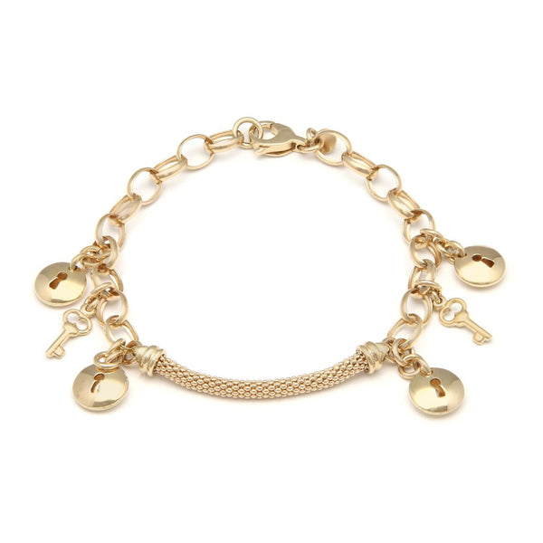Pulsera eslabón combinado con colgantes motivo llave y cerradura en oro amarillo 14 kilates.