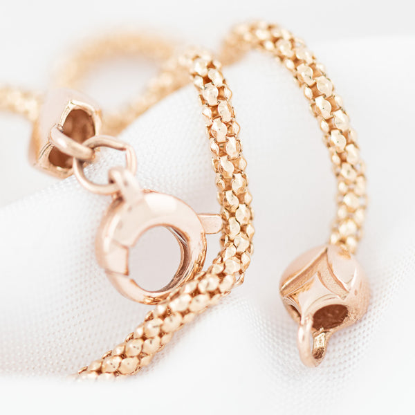 Pulsera eslabón articulado en oro rosa 14 kilates.