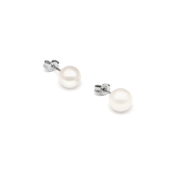 Aretes diseño especial con perlas en oro blanco 14 kilates.