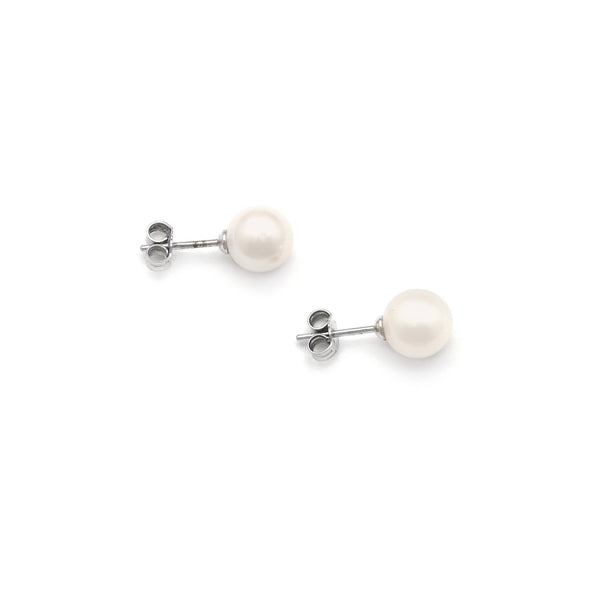 Aretes diseño especial con perlas en oro blanco 14 kilates.
