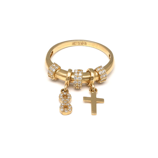Anillo diseño especial con colgantes motivo infinito y cruz con circonias en oro amarillo 14 kilates.