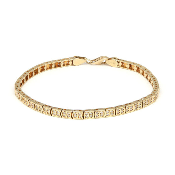 Pulsera eslabón articulado con circonias en oro amarillo 14 kilates.
