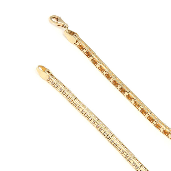 Pulsera eslabón articulado con circonias en oro amarillo 14 kilates.