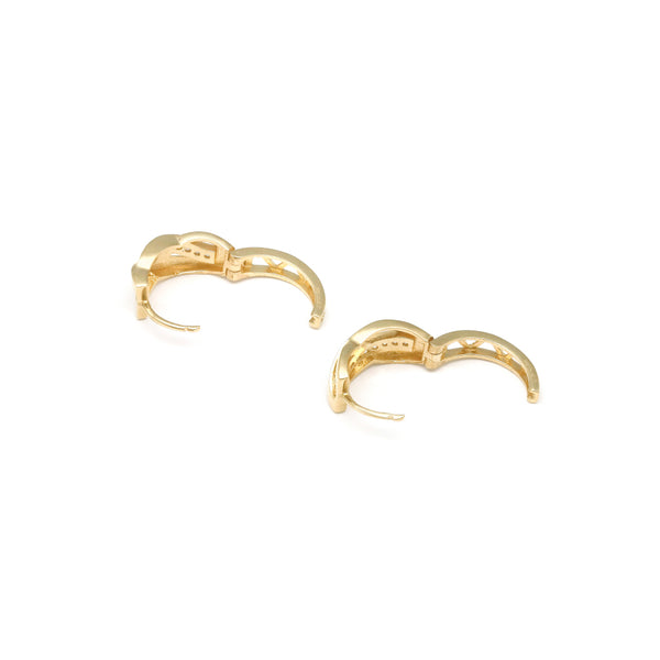 Arracadas articuladas con circonias en oro amarillo 14 kilates.