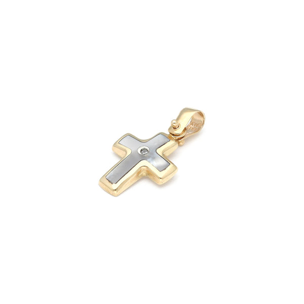 Cruz diseño especial con madre perla y circonias en oro amarillo 14 kilates.