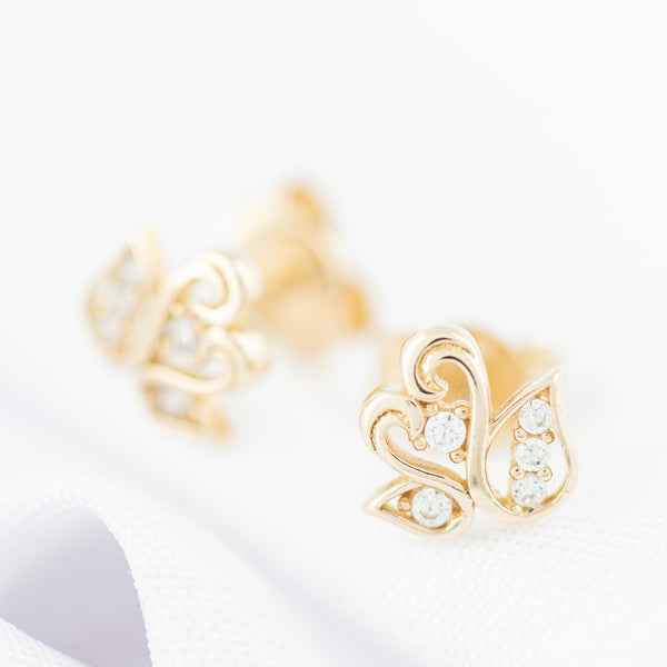 Aretes diseño especial motivo cisnes con circonia en oro amarillo 14 kilates.