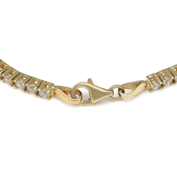 Pulsera eslabón articulado con aplicaciones y colgantes de circonias en oro amarillo 14 kilates.