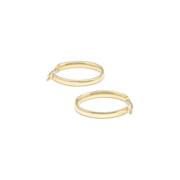 Arracadas lisas huecas en oro amarillo 14 kilates.
